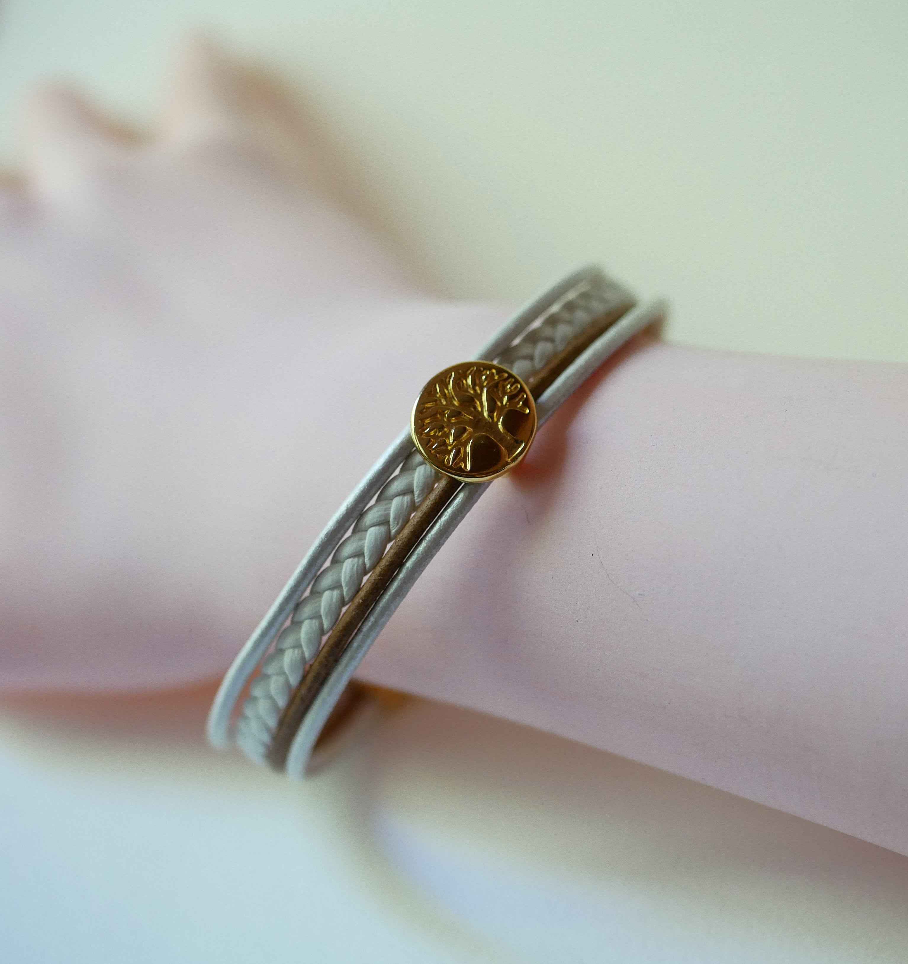 Mansjettarmbånd i hvitt og gull med cabochon av livets tre