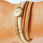 Mansjettarmbånd i skinn med flere lenker og solstråle-løkke i gull